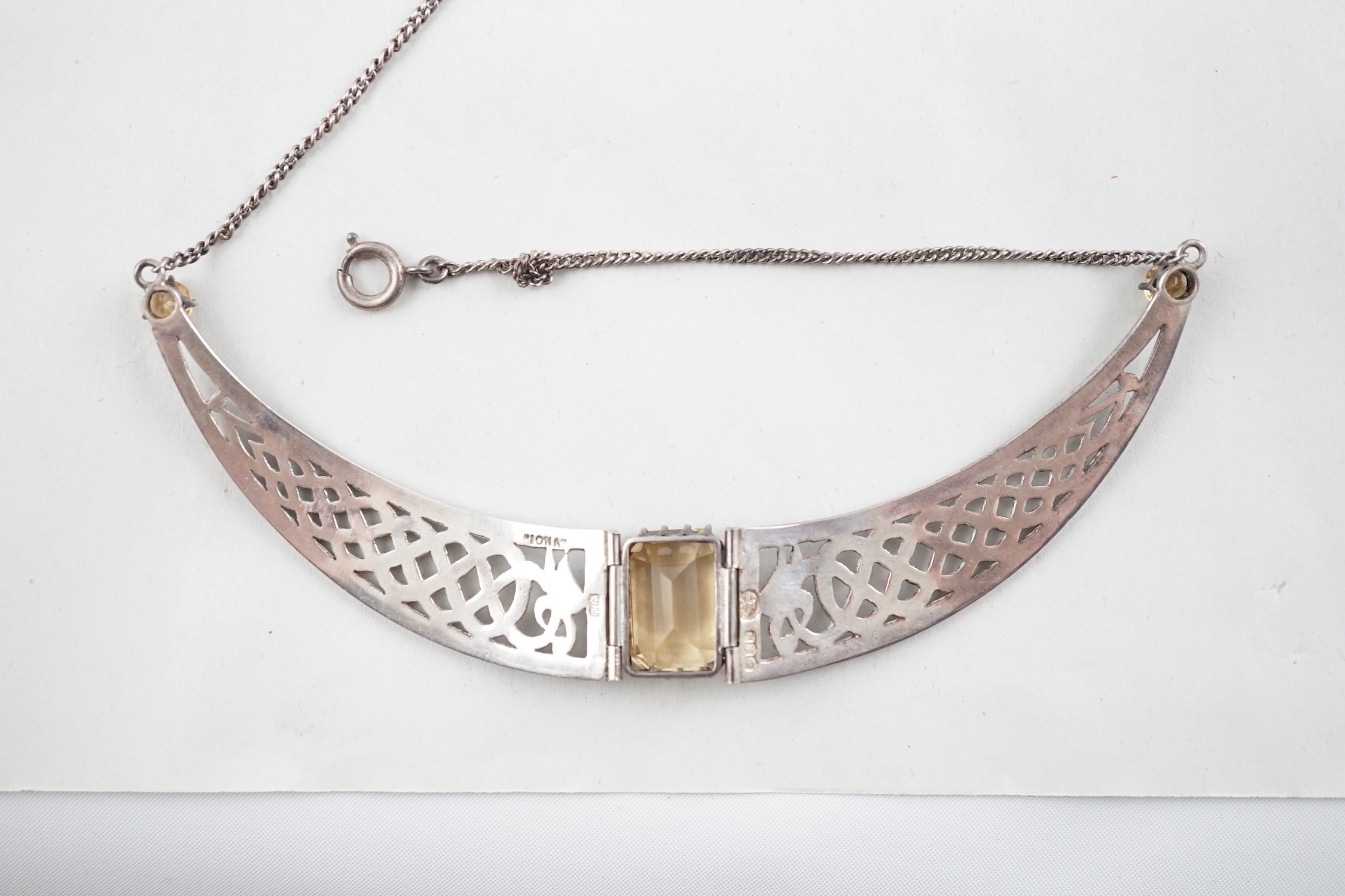 An Elizabeth II Scottish Iona silver and three stone citrine set Celtic demi-lune necklace